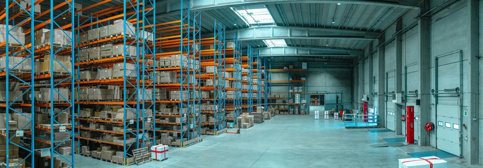Interior of a large commercial distribution warehouse with high-bay racking